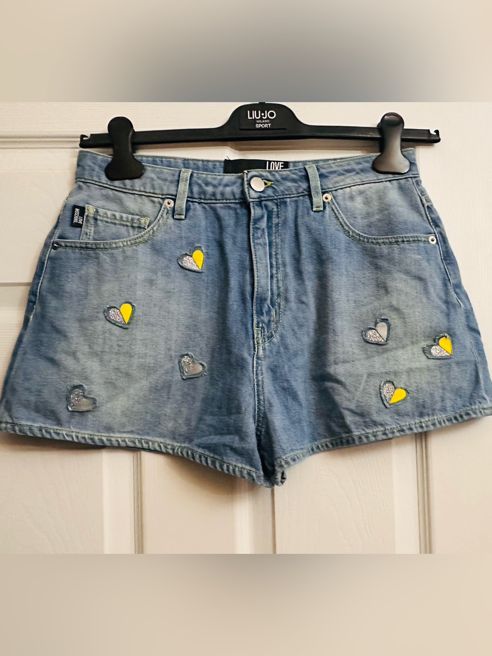 Love Moschino Light Wash Denim Shorts with Yellow & Silver Heart Patches